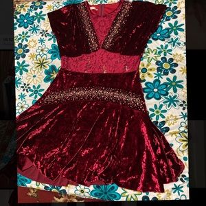 An elegant short dark red dress